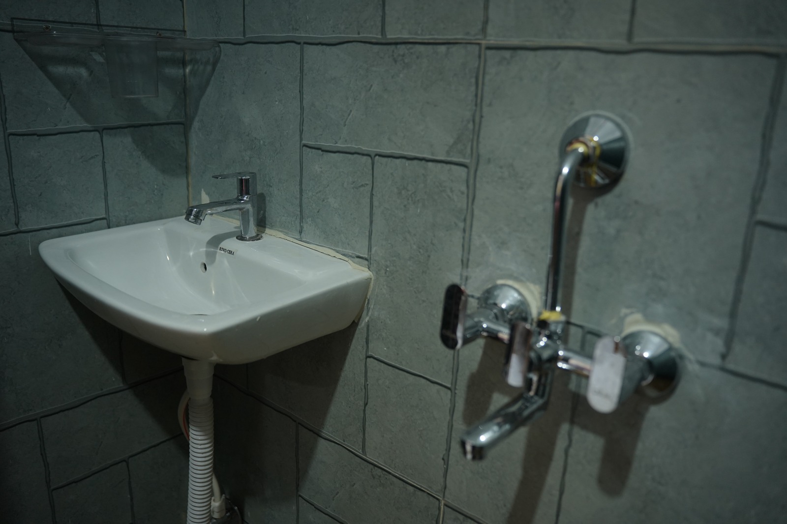 Bathroom with washbasin and hot water shower