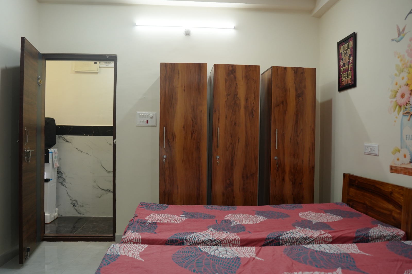Spacious PG room with wooden wardrobes